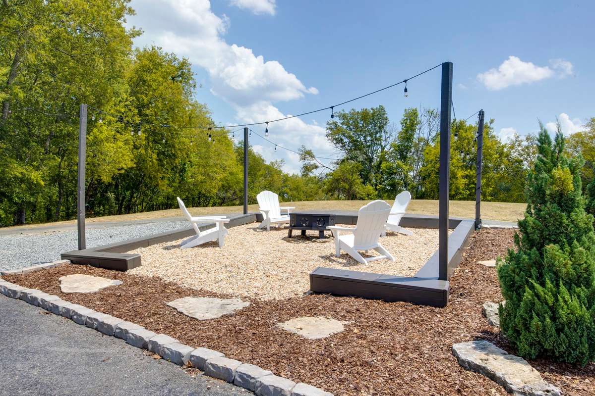 Relax on the huge deck or the partially covered patio with fireplace, unwind in the hot tub, or gather around the gravel fire pit.