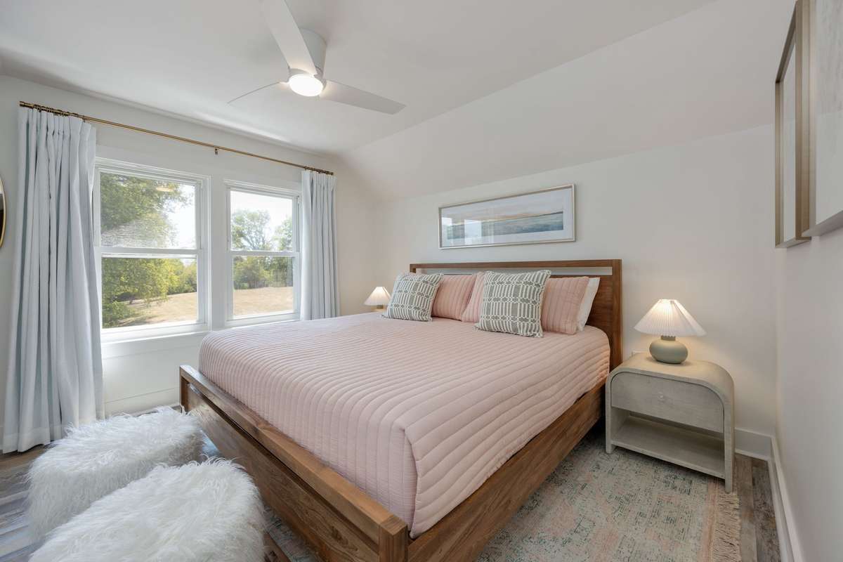 Upstairs, two bedrooms share a beautifully updated full bath