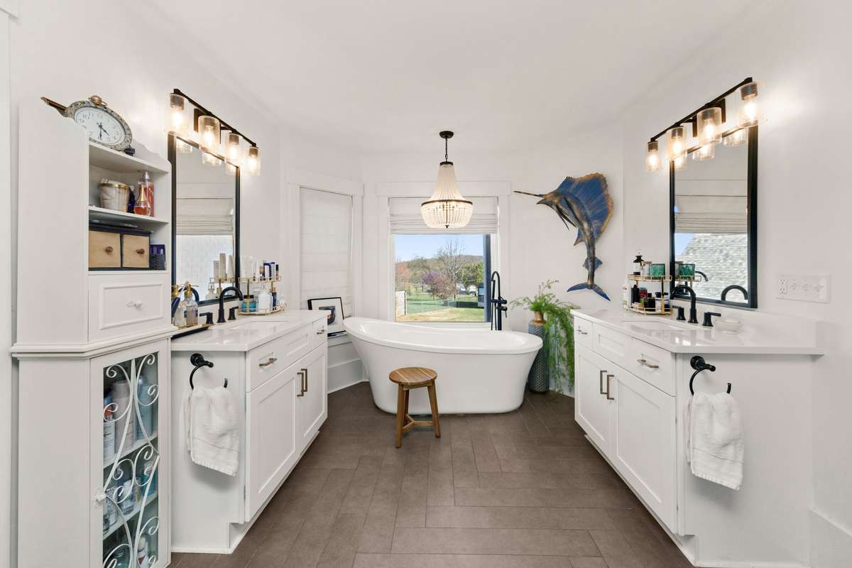 Primary Bathroom. Double Vanities. Large, Free-standing Soaking Tub, Walk-In Shower.