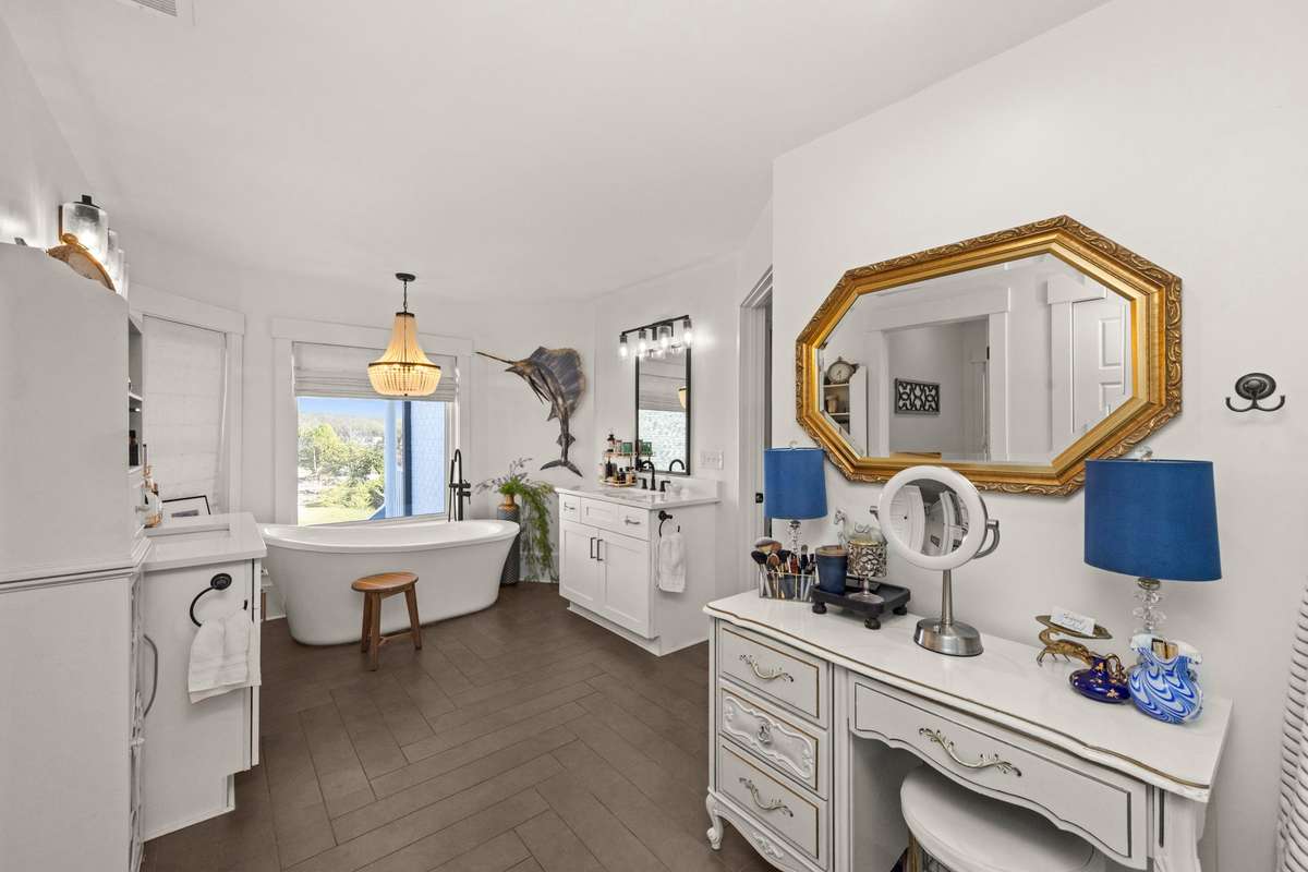 Primary Bathroom. Double Vanities. Large, Free-standing Soaking Tub, Walk-In Shower.