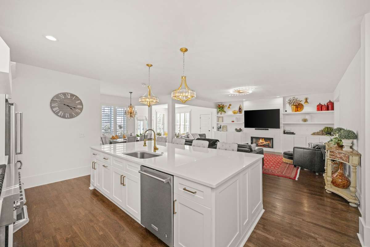 Primary Kitchen. Large Island. Quartz Countertops. Double Gas Oven/Range. 2 Pantries. Additional Eat-In Kitchen Area. SS Appliances.