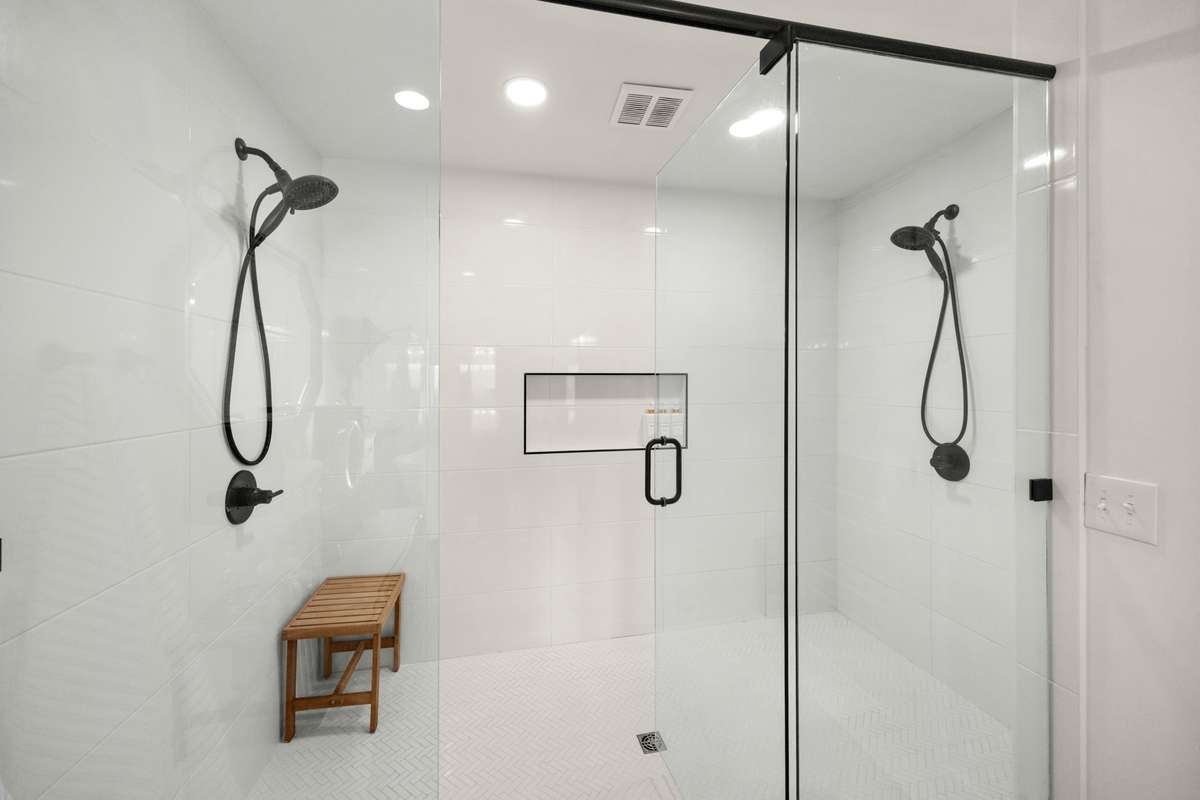 Primary Bathroom. Double Vanities. Large, Free-standing Soaking Tub, Walk-In Shower.