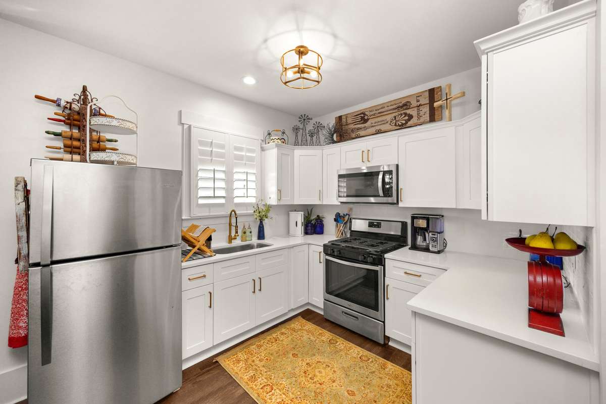 Separate In-Law Quarters. Private Entrance. Secondary Living Area. Secondary Full Kitchen. Secondary Laundry Room. Half Bathroom Downstairs. Private Bedroom & Full Bathroom Upstairs. Connected to Main Living Area through Upstairs Hallway.