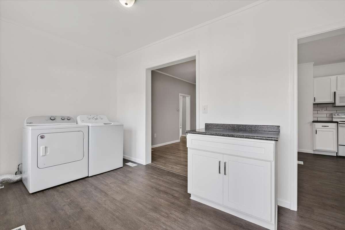 Your laundry room is PLENTY big for a mudroom space and folding space.
