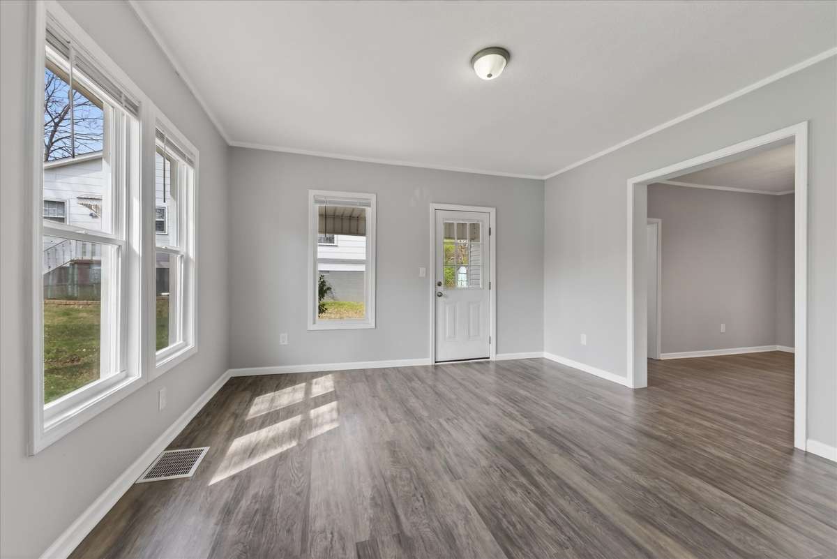 Living room (showing door to patio) and plenty of natural light!