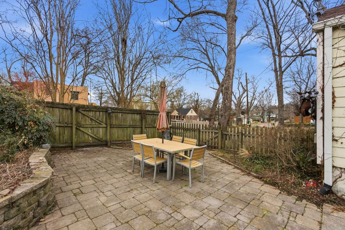 The paver patio was added in 2005 along with the adjoining garden bed and charming crepe myrtles.