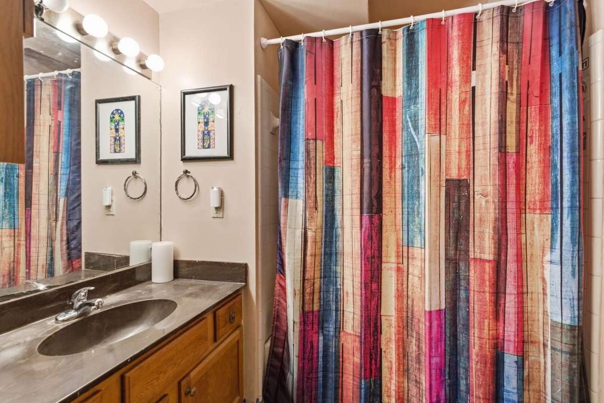 The bathroom is located on the main level and contains a shower/tub combo.