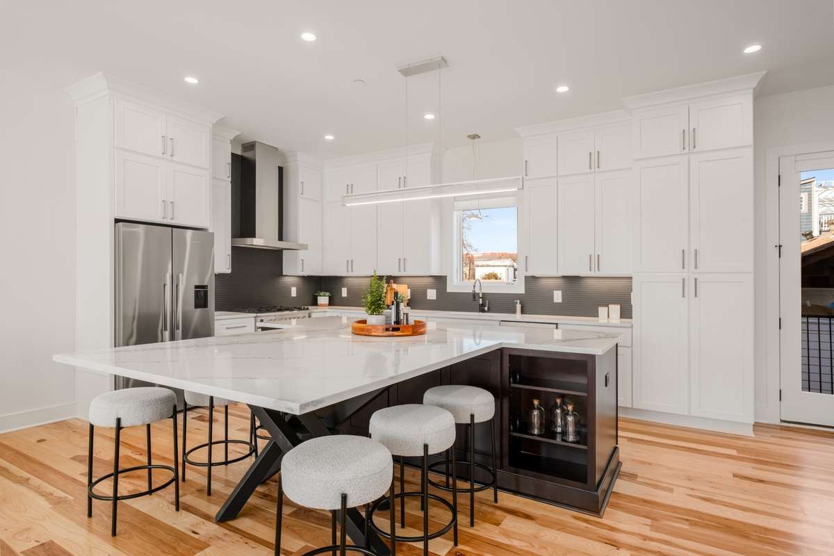 The spectacular kitchen is punctuated by the art-inspired design of the built-in table.