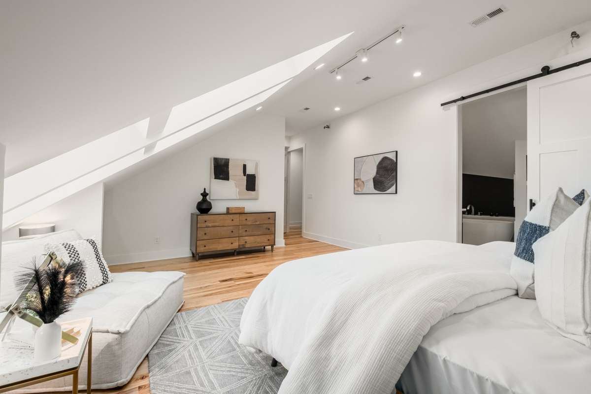 Imagine settling into this cozy nook under the skylights with your favorite book and a warm cup of tea.