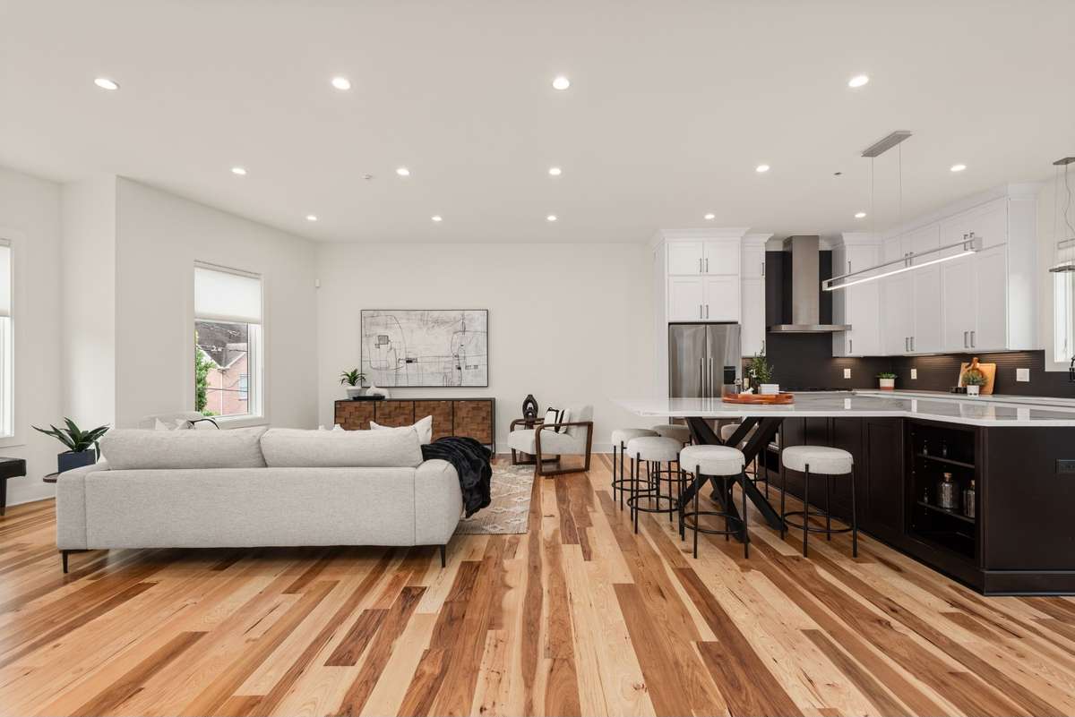 Upstairs, you'll find the spacious and beautiful heart of the home - the stunning kitchen and dining area, the large and light-filled living room, a built-in work-from-home space, a full bathroom, and a private balcony!