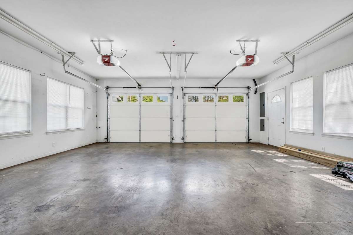 EXTRA LARGE 2 Car Garage will hold 2 Large Cars 
***PLUS***There is Workshop/Storage Area