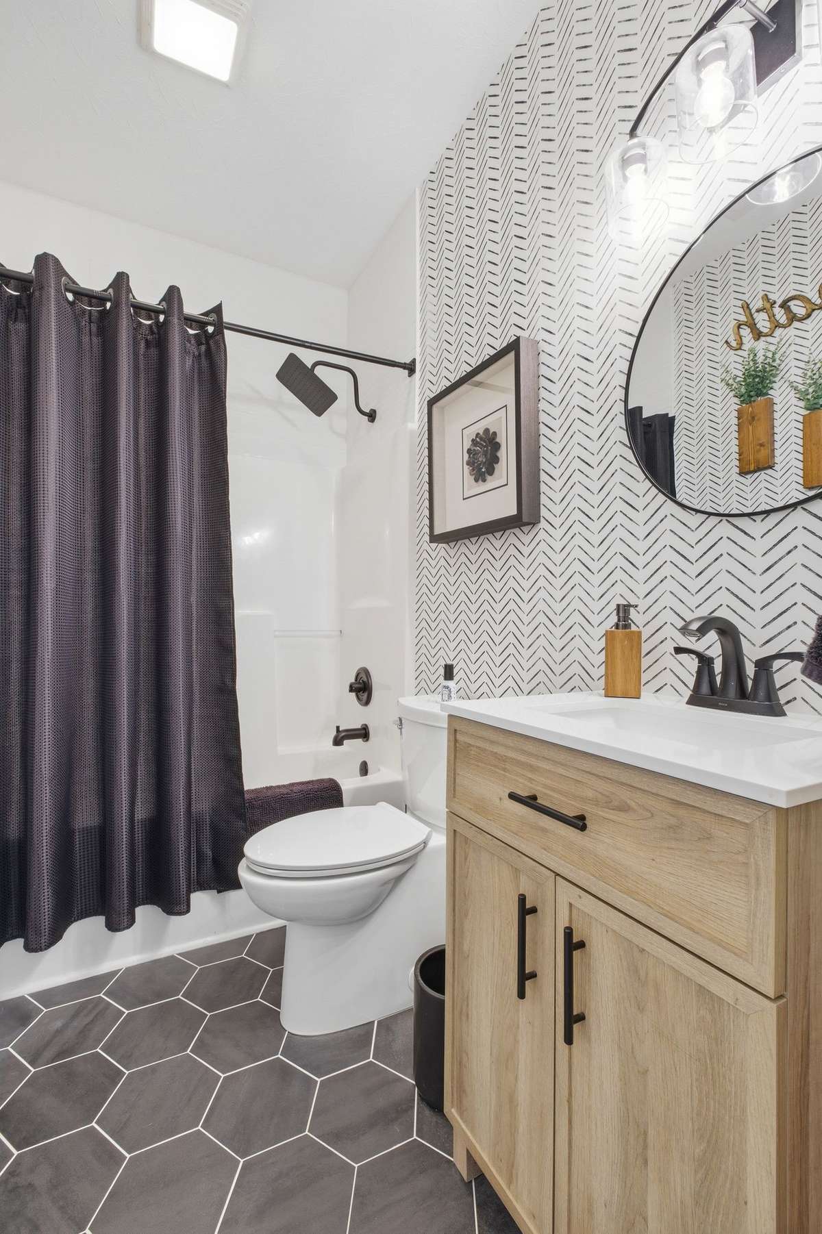 Updated 2nd bath located between the two guestrooms.
