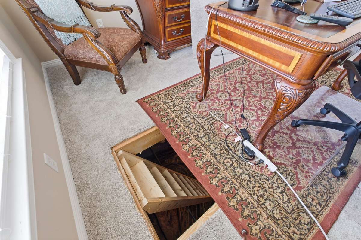 Trap door in office that goes to safe place from storms.  When the trap door is not in use it's hidden.
