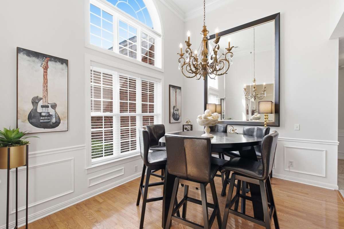 Beautiful dining room opens to the family room. Mirror in dining room to convey with sale.