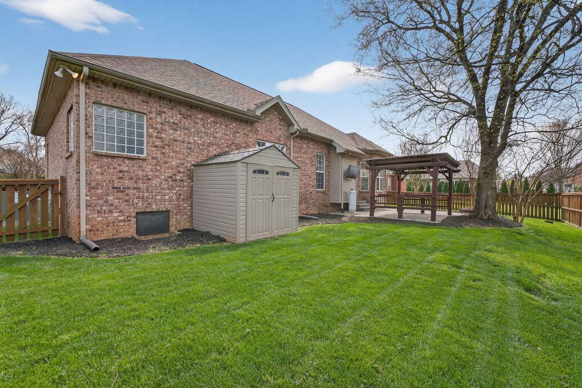 Good sized back yard with shed to remain.