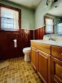 Bathroom on main level has shower/tub combo but needs some love.