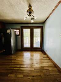 Eat in Kitchen area with french doors leading to the 8x23 deck overlooking the back yard.