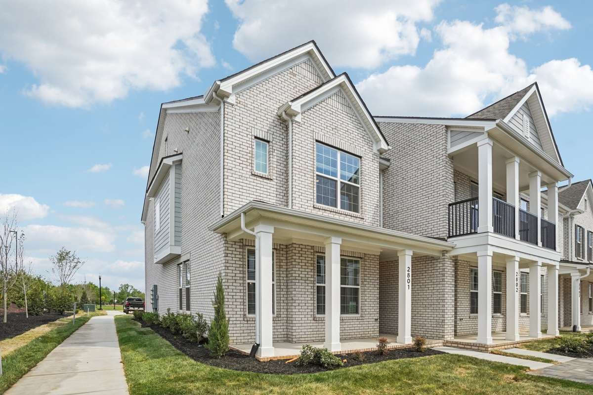 The covered front porch is the ideal spot to unwind - savor your morning coffee or get lost in a good book while enjoying the fresh air.