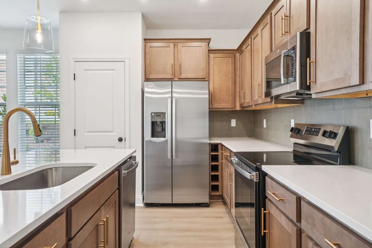 Enjoy a kitchen with abundant storage, featuring ample cabinetry and smart organization to keep everything within easy reach while maintaining a clean, spacious look.