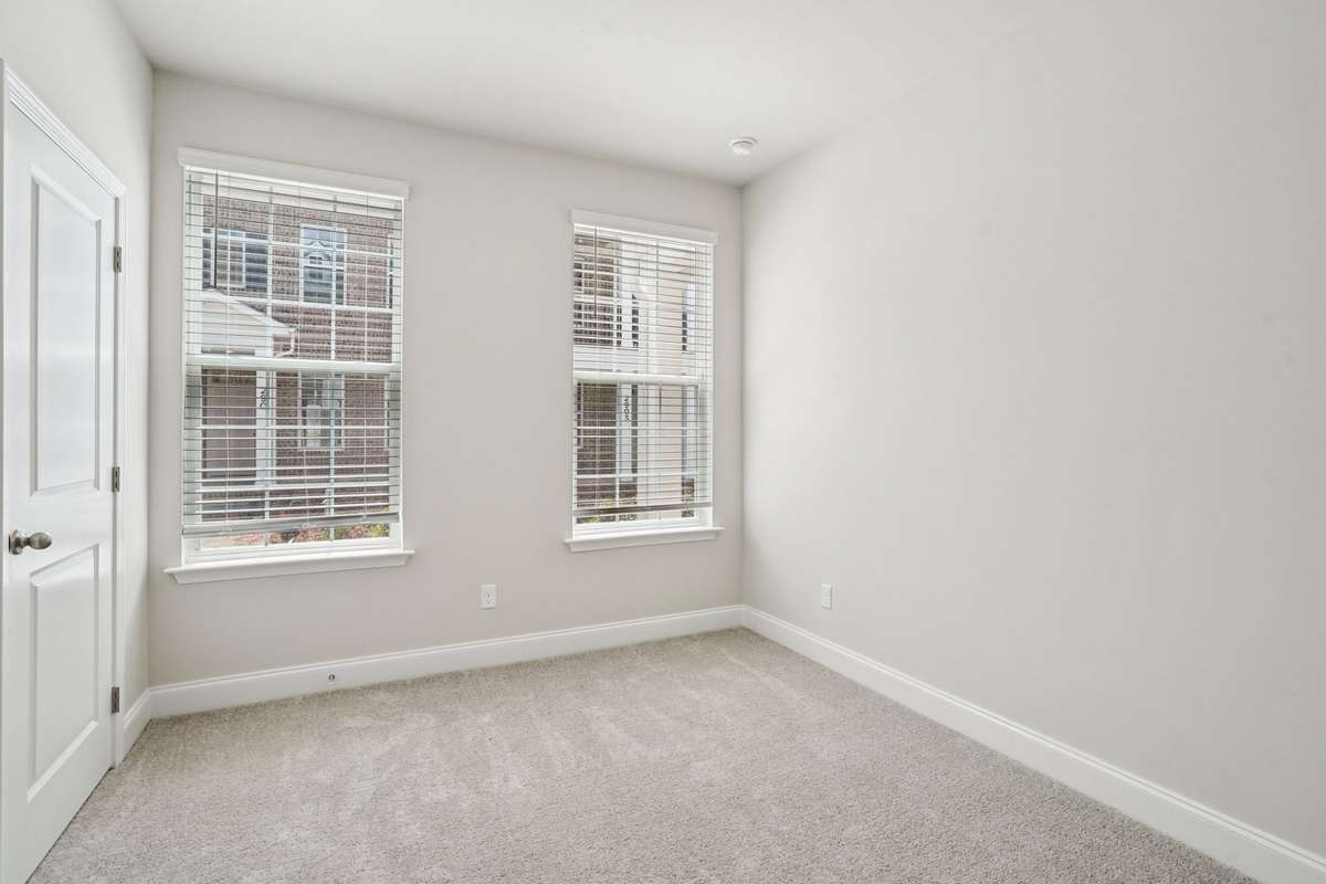 The second Bedroom is located on the lower level, offering added privacy for both bedrooms and creating a versatile space for guests or family.