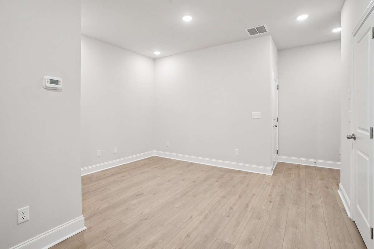 A versatile lower-level flex space offers endless possibilities—ideal for a home office, craft room, or additional living area. Perfect for remote work, this private retreat keeps the main living spaces open, organized, and free from distractions.