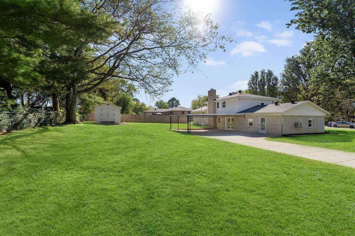 Beautiful yard is partially fenced.