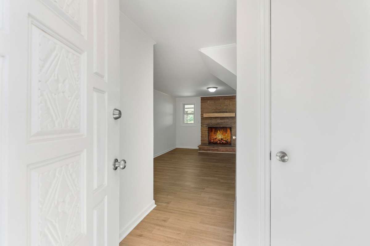 Front entry.  All new flooring downstairs.  Stairs to the 2nd/middle level are to the right as you go in the front door.