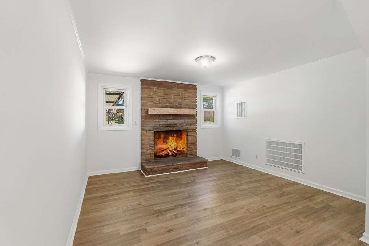 Cozy den with new gas logs.