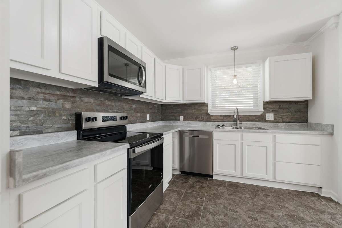 New cabinets, counter tops, sink, lighting, and stainless appliances.