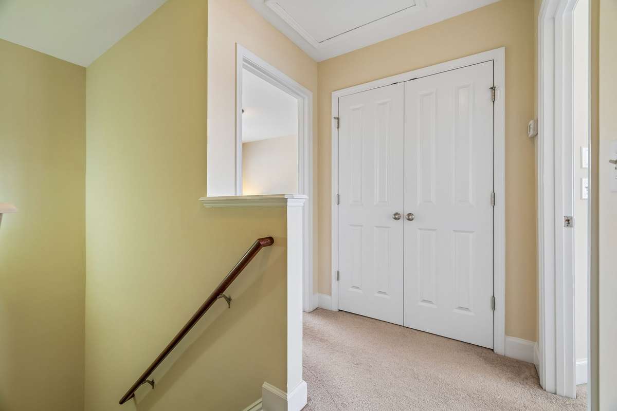 Storage closet hallway between both bedrooms