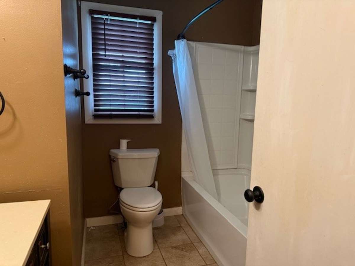 The main bathroom has a shower tub combo.