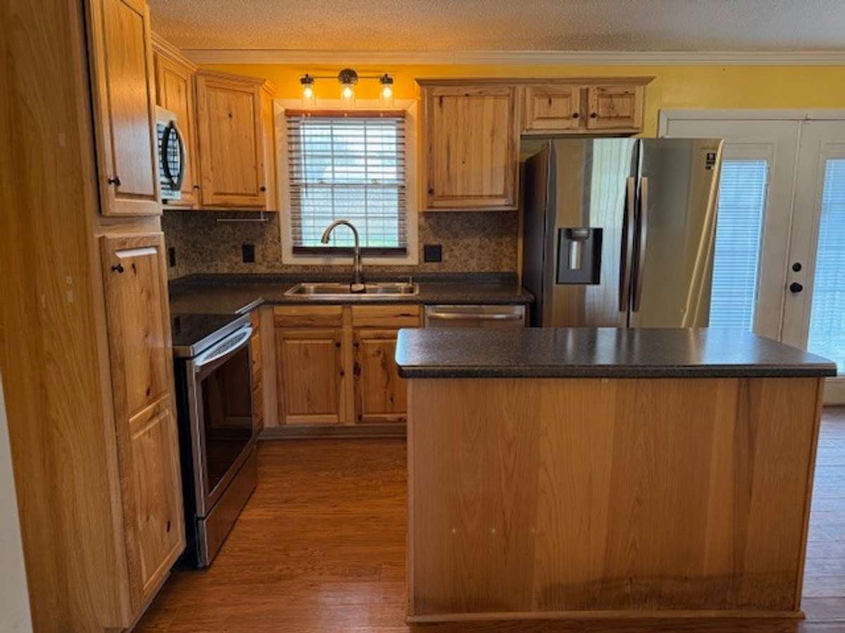 The stove, range, microwave, dishwasher, and refrigerator will remain with the property.