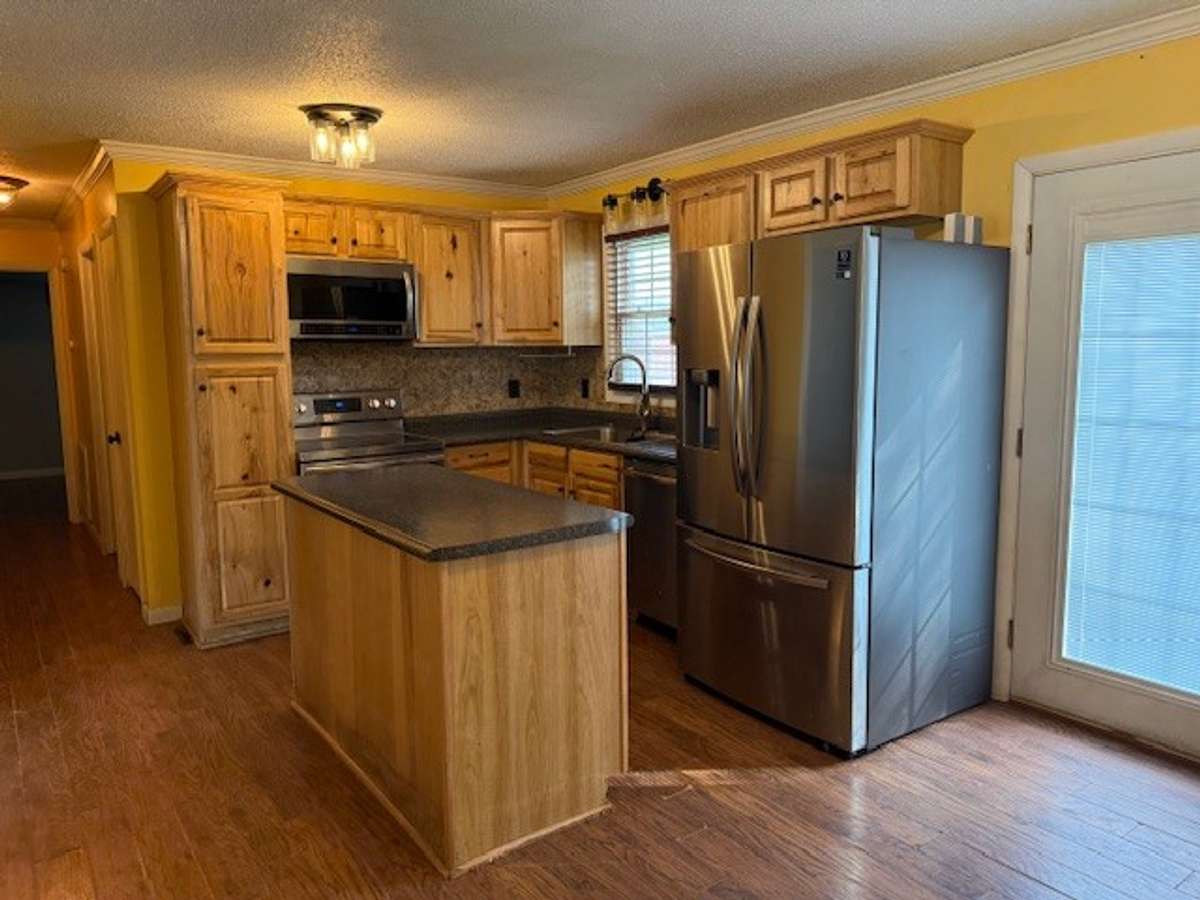 The eat-in kitchen has plenty of storage.