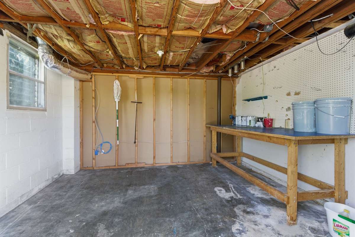 Lawnmower or implement storage - lockable with exterior door at the back of home.