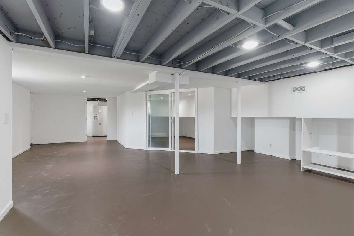 Flex space for entertaining or play space. The room in the background has a glass sliding door and was used as a home office. Ethernet cable is install downstairs as well as two rooms upstairs.