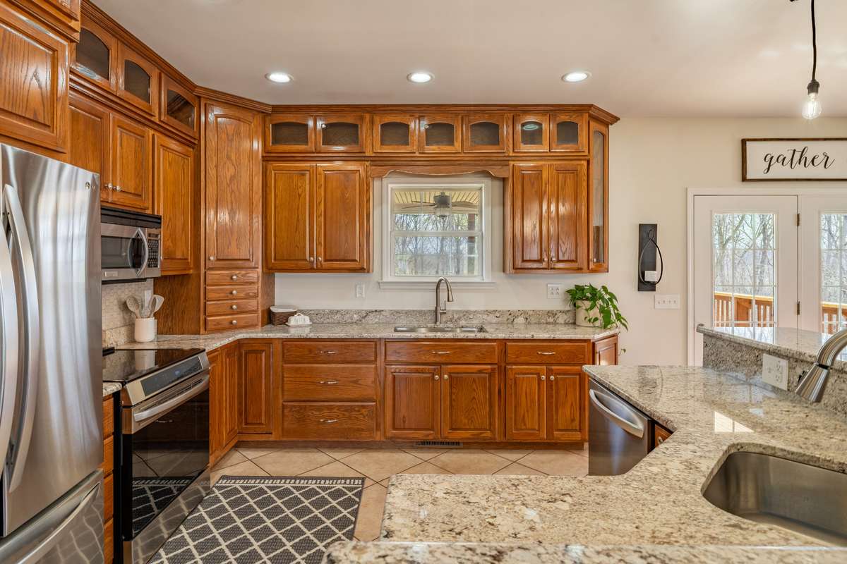 Solid wood cabinets with stainless steel appliances