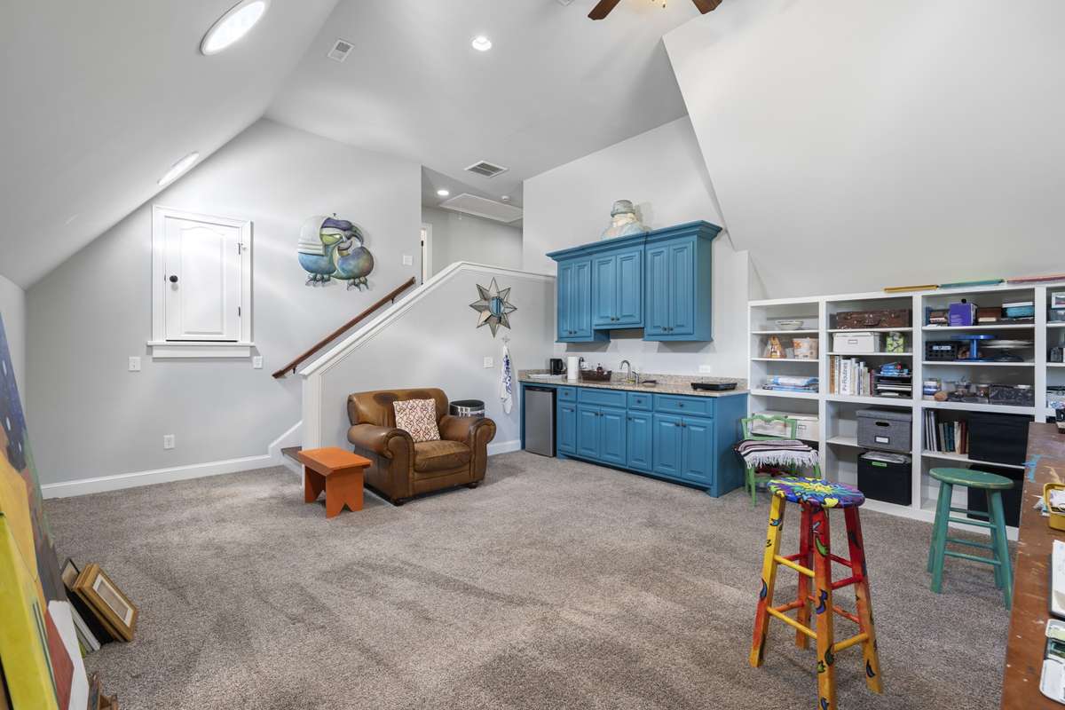 Complete with a wet bar area and plenty of cabinet storage.