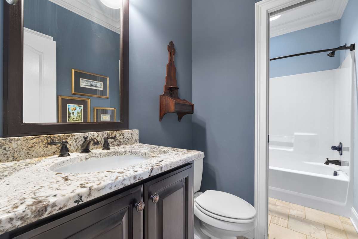 Adjacent to the current home office is a full bath.