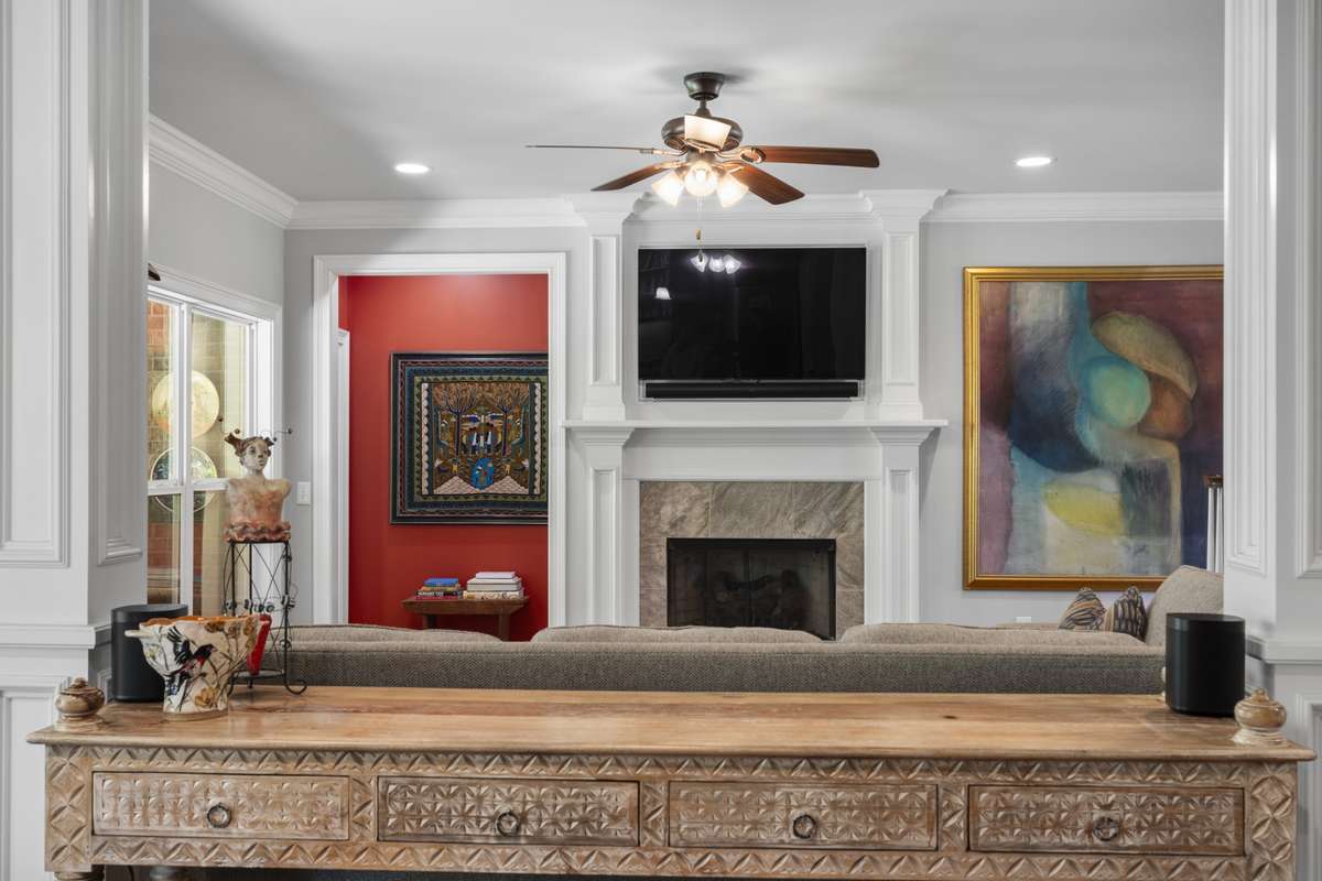View from the kitchen to the living room with fireplace.