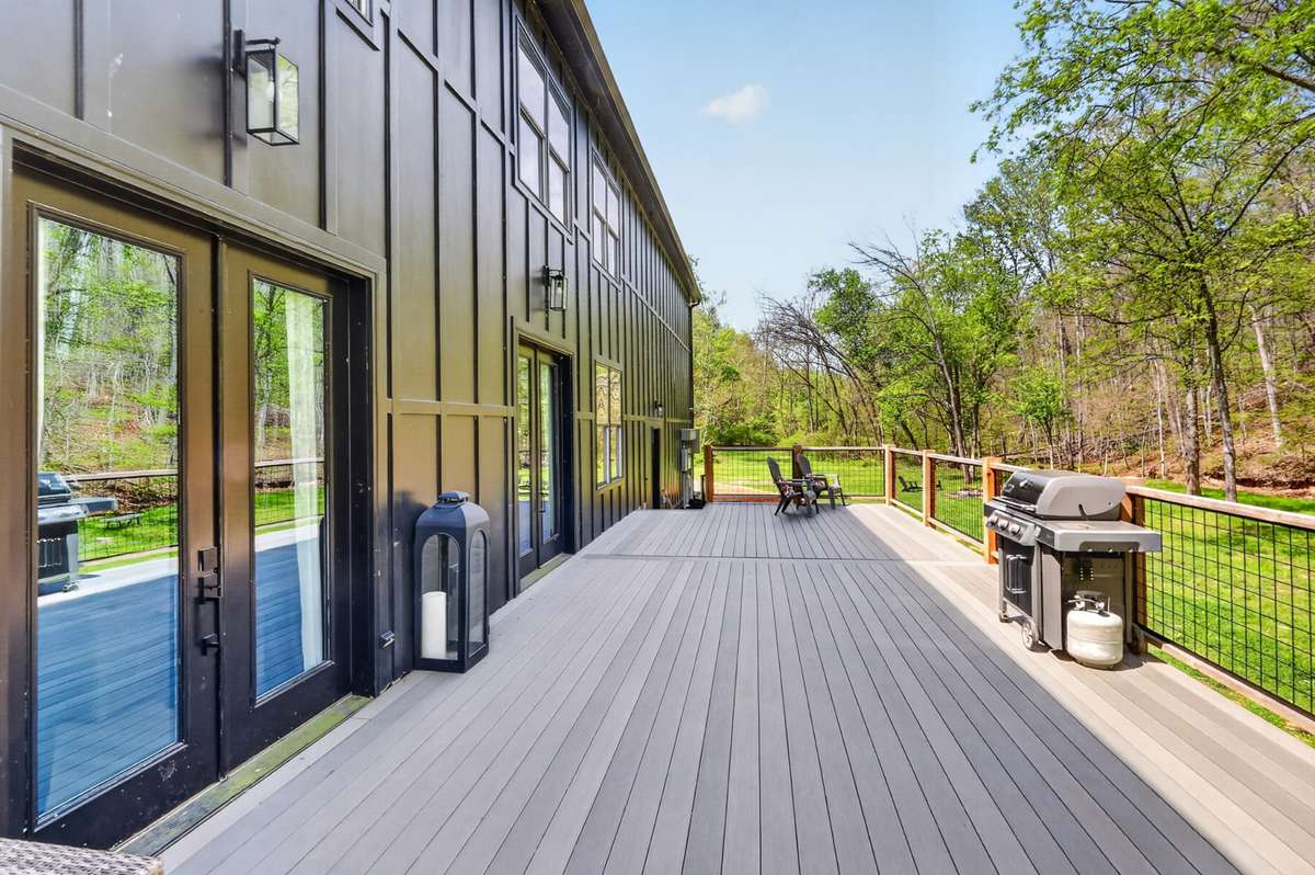 Spacious deck with opportunity to add a pergola or additional covered structure to enhance outdoor living.