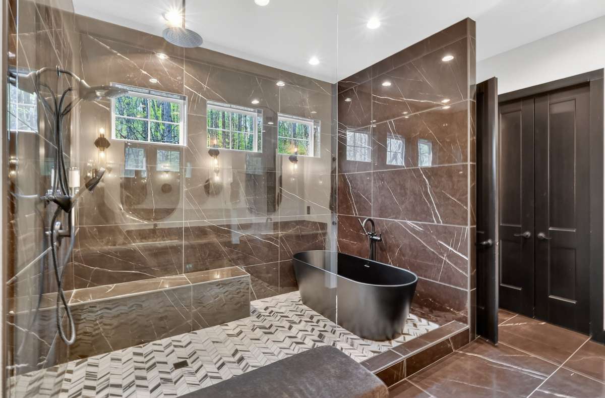 Spa-like bath with a walk-in shower and separate soaking tub.