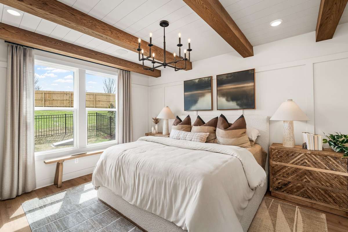 Primary Bedroom (downstairs) ft. beautiful windows for natural light *Photo for example only - previously built Ellsworth*