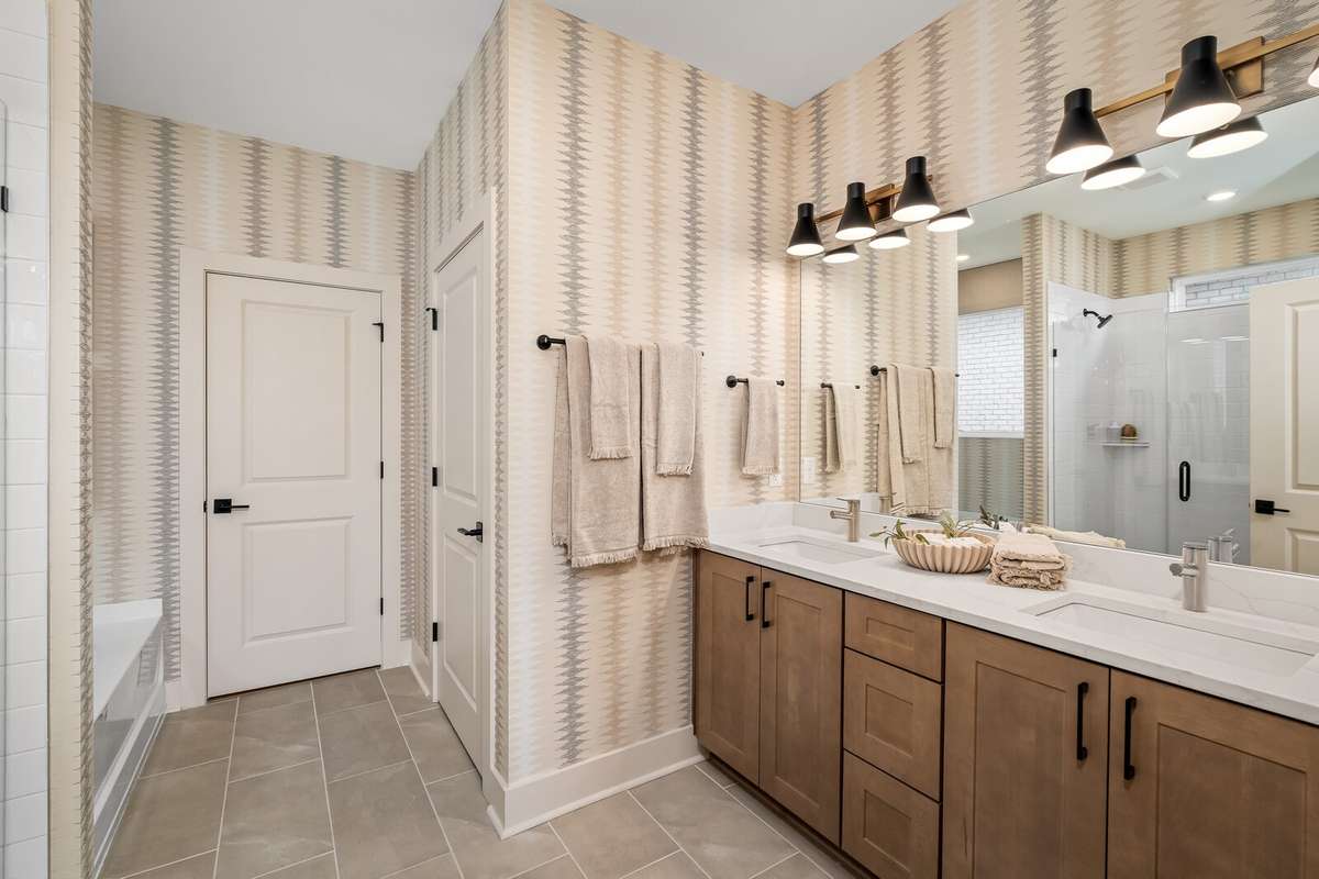Primary Bath with SOFT close cabinets, QUARTZ countertops, upgraded tile and faucets *Photo for example only - previously built Ellsworth*