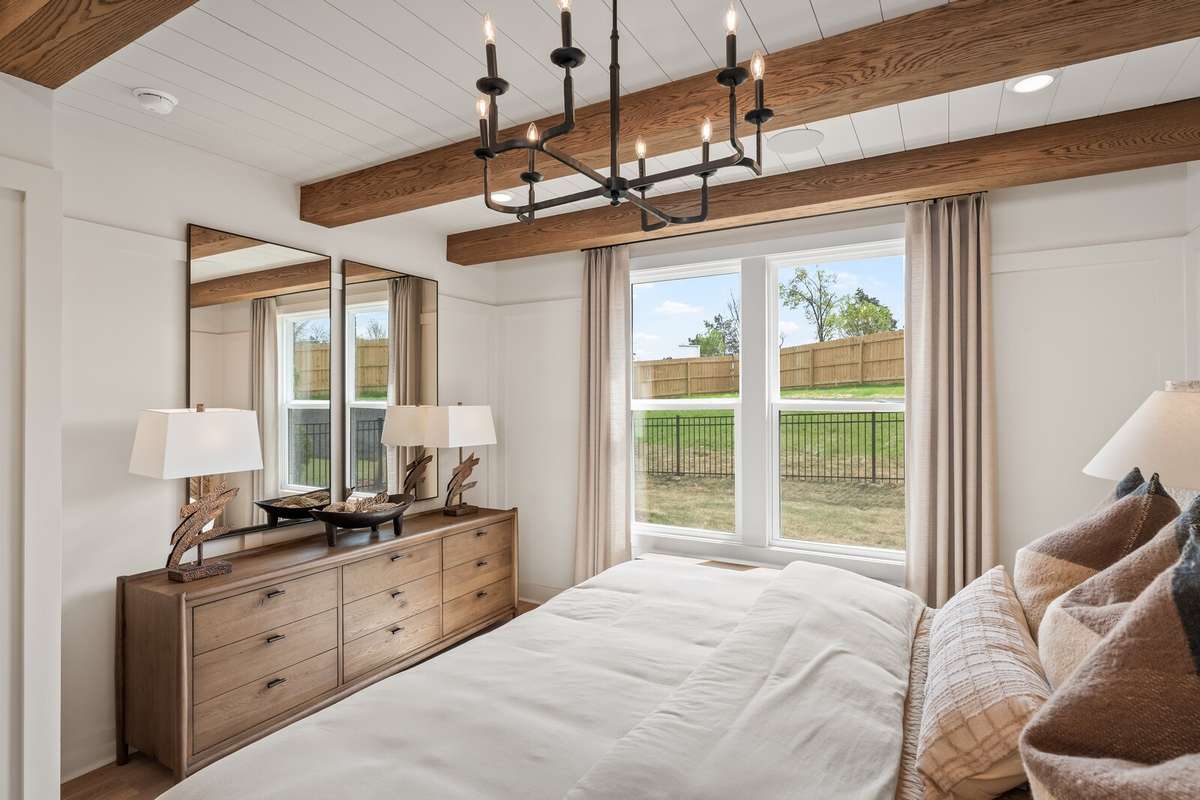 Primary Bedroom (downstairs) ft. beautiful windows for natural light *Photo for example only - previously built Ellsworth*
