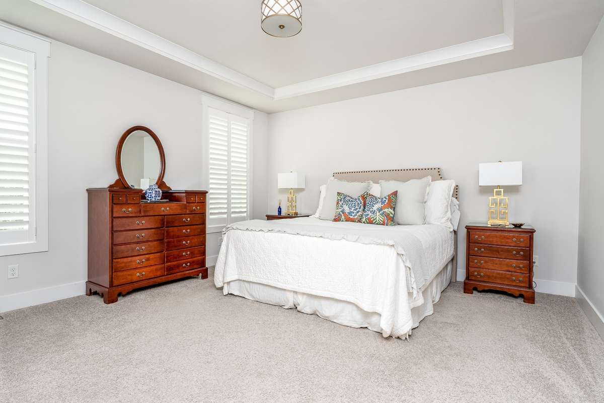 Primary Suite is located on the main level and features tray ceilings
