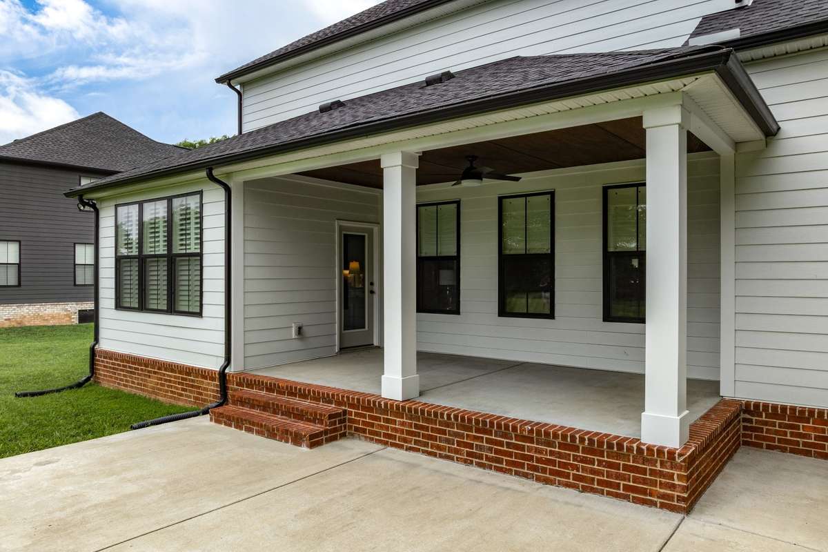 Back Porch for Outdoor Living and Concrete Patio for Grilling