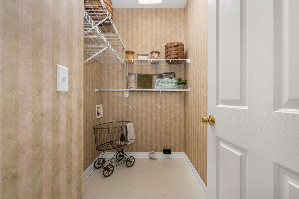 The laundry room is located just off the kitchen.