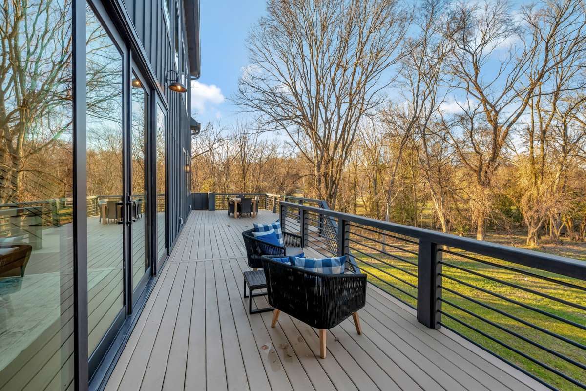 Decks and Porch Span the Entire Length of the back of the home taking full advantage of the Unique Setting. Privacy combined w Views