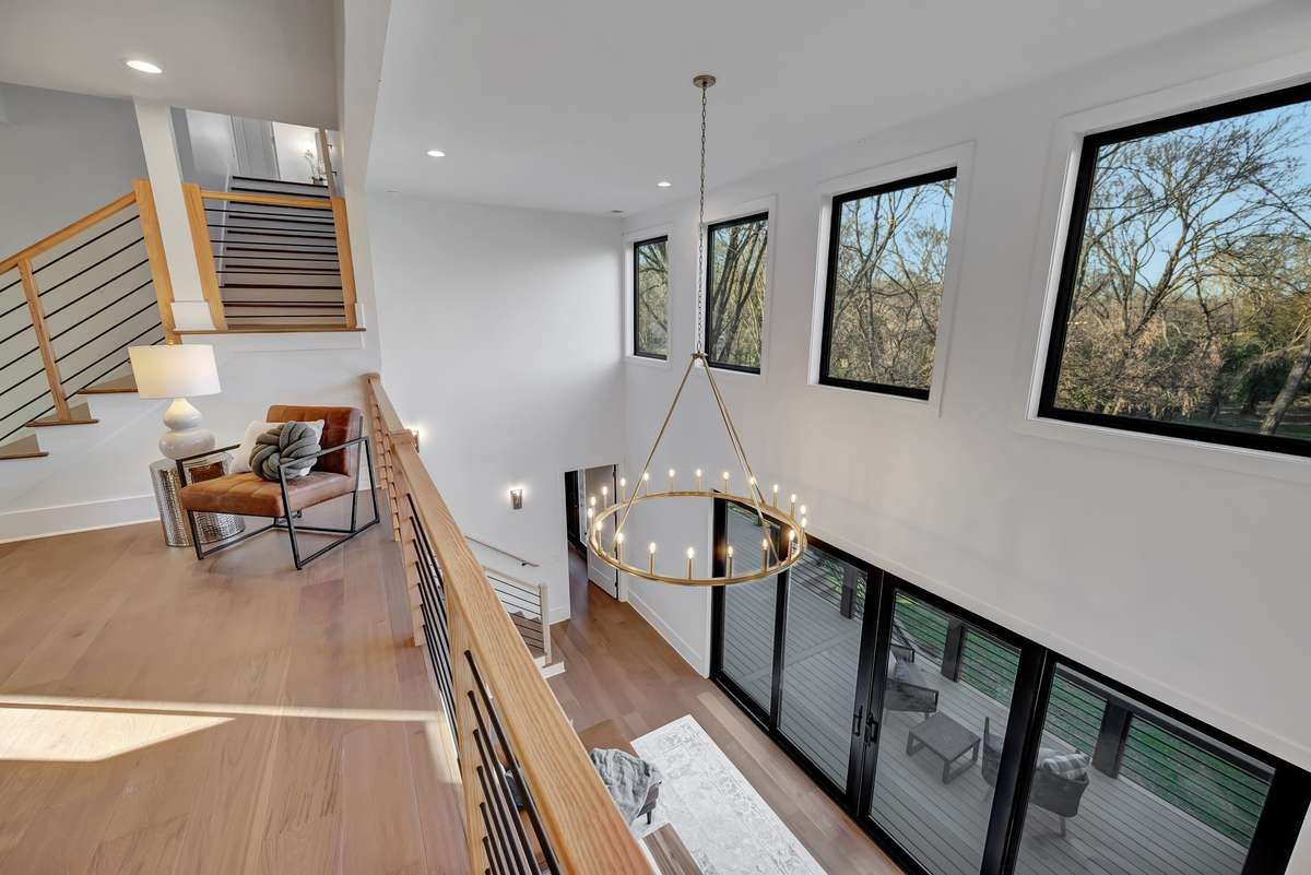 Upstairs Den/Sitting Rm overlooking the Great Rm along w Views of Backyard
