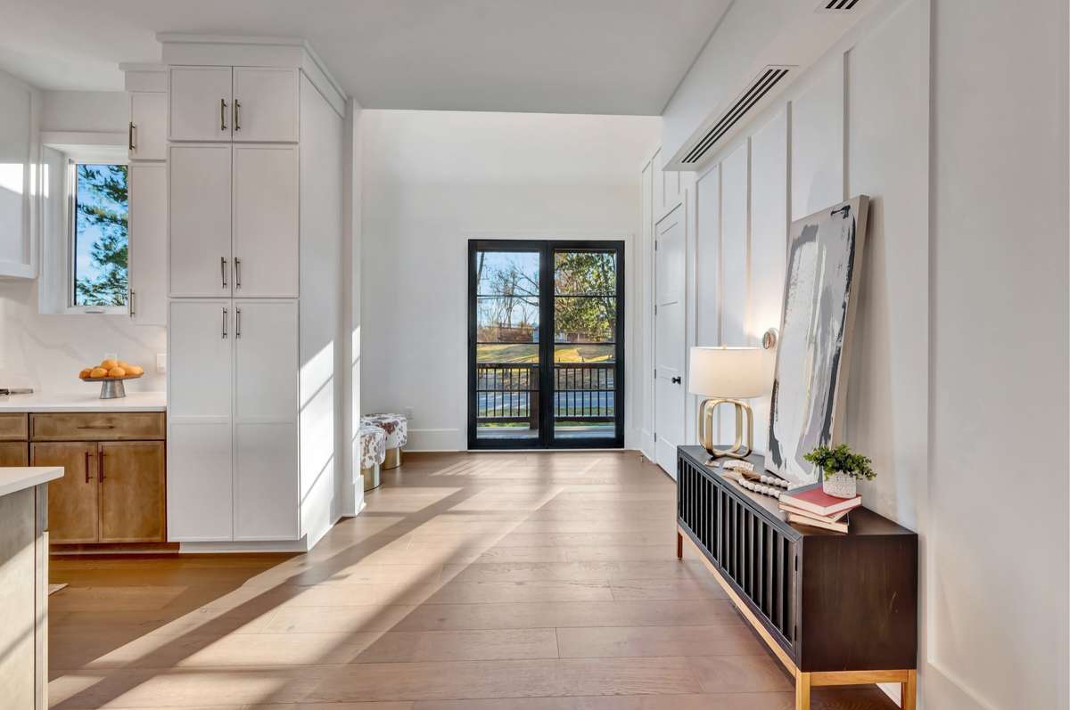 Your Double Door Entryway with coat closet is an invitation to come and explore this Custom Home